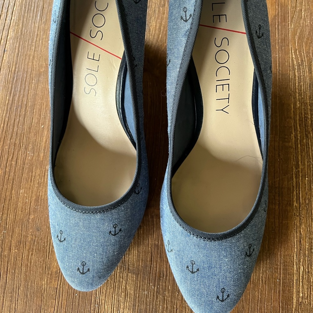 Nautical themed wedge shoes.Blue denim color with dark blue anchors. Size 9.